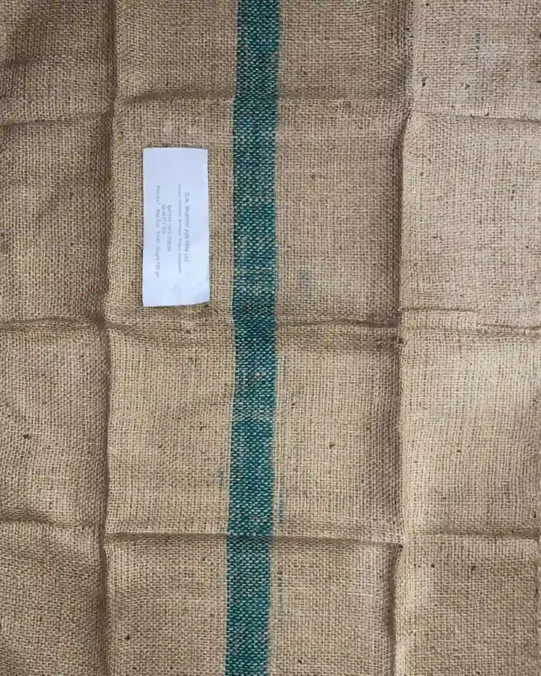 SA Shamim Jute Mills official factory specification label on 100% tossa D.W. sacking bag with green stripe